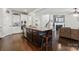 Kitchen island features bar seating, stainless appliances and granite countertops at 1276 Stonecrest Blvd, Tega Cay, SC 29708