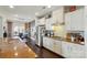 Bright kitchen featuring stainless steel appliances, granite countertops, and an adjacent dining area at 1276 Stonecrest Blvd, Tega Cay, SC 29708