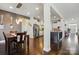 Open-concept kitchen with stainless steel appliances, island, and pendant lighting at 1276 Stonecrest Blvd, Tega Cay, SC 29708