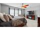 Spacious primary bedroom featuring a ceiling fan and a comfortable sitting area at 1276 Stonecrest Blvd, Tega Cay, SC 29708