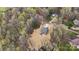 Aerial view shows the home nestled within a wooded neighborhood at 130 Big Oak Ln, Statesville, NC 28625