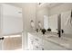 Bathroom featuring double sinks, black hardware, and a large mirror at 130 Big Oak Ln, Statesville, NC 28625