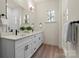 Elegant bathroom features double vanity, modern fixtures, and a large mirror for a luxurious feel at 130 Big Oak Ln, Statesville, NC 28625