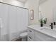 Bright bathroom featuring a shower-tub combo and a white vanity at 130 Big Oak Ln, Statesville, NC 28625