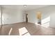 Large bedroom with hardwood floors and two doors leading to additional rooms at 130 Big Oak Ln, Statesville, NC 28625