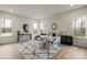 Bright bedroom featuring hardwood floors, neutral walls, and natural light from multiple windows at 130 Big Oak Ln, Statesville, NC 28625