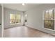 Sunlit bedroom featuring large windows offering natural light and beautiful exterior views at 130 Big Oak Ln, Statesville, NC 28625