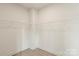 Spacious walk-in closet featuring ample shelving for optimal storage in a modern home at 130 Big Oak Ln, Statesville, NC 28625