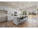 Bright, open kitchen features white cabinets, quartz countertops, pendant lighting and stainless steel appliances at 130 Big Oak Ln, Statesville, NC 28625