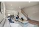 Open-concept living room features hardwood floors, modern furniture, and plenty of natural light at 130 Big Oak Ln, Statesville, NC 28625