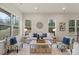 Bright living room features large windows, neutral paint, stylish furnishings, and plush white rug at 130 Big Oak Ln, Statesville, NC 28625