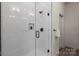 Modern shower with subway tile, glass door, and sleek fixtures, offering a clean and stylish design at 130 Big Oak Ln, Statesville, NC 28625