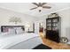 Comfortable bedroom with hardwood floors, ceiling fan and neutral tones at 1411 Congress St, Gastonia, NC 28054