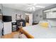 Bedroom with wood floors, ceiling fan and open doorway leading to other rooms at 1411 Congress St, Gastonia, NC 28054