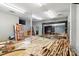 Bright open room with unpolished concrete floors, stacked wood, and visible pipes and duct work at 1411 Congress St, Gastonia, NC 28054