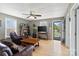 The living room has wood floors, comfortable seating, and a ceiling fan at 1411 Congress St, Gastonia, NC 28054