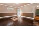 Bright bedroom features hardwood floors, ample natural light, and a welcoming atmosphere for relaxation and comfort at 1500 Griffith Rd, Monroe, NC 28112