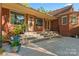 Brick home exterior featuring a stone patio and steps leading to the entrance at 1500 Griffith Rd, Monroe, NC 28112