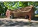 Spacious brick garage with a large open area, perfect for parking and storage at 1500 Griffith Rd, Monroe, NC 28112