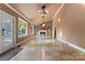 Bright living room with tile floors, vaulted ceiling, unique ceiling fan, and gas fireplace, perfect for relaxing at 1500 Griffith Rd, Monroe, NC 28112