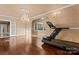 Open floor plan with a crystal chandelier, hardwood floors, and large windows offering ample natural light at 1500 Griffith Rd, Monroe, NC 28112
