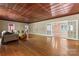 Bright living room with polished hardwood floors and an airy layout, perfect for entertaining guests at 1500 Griffith Rd, Monroe, NC 28112