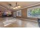 Bright living space features tile floors, large windows, and an open layout connecting to the kitchen for easy entertaining at 1500 Griffith Rd, Monroe, NC 28112