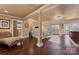 Expansive room with wood floors, decorative columns, ensuite bathroom, and natural light at 1500 Griffith Rd, Monroe, NC 28112