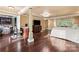 Open bedroom area showcases hardwood floors, natural light, decorative columns, and comfortable living at 1500 Griffith Rd, Monroe, NC 28112