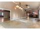 Expansive open floor plan with tile flooring, recessed lighting, and a seamless flow between living and dining areas at 1500 Griffith Rd, Monroe, NC 28112