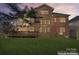 Brick home with large back deck and yard offers comfortable outdoor living at 15009 Lisha Ln, Charlotte, NC 28277