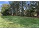 Expansive grassy backyard provides plenty of space for recreation and outdoor activities at 15009 Lisha Ln, Charlotte, NC 28277