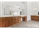 Spacious bathroom with dual vanities, tile flooring, large mirrors, and ample lighting at 15009 Lisha Ln, Charlotte, NC 28277