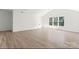 Spacious bedroom with high vaulted ceilings and large windows offering natural light at 15009 Lisha Ln, Charlotte, NC 28277