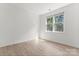 Bright bedroom featuring hardwood floors, natural light, and neutral color palette at 15009 Lisha Ln, Charlotte, NC 28277