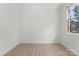Neutral bedroom with hardwood floors, large window, and white trim at 15009 Lisha Ln, Charlotte, NC 28277