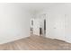 Spacious bedroom with hardwood floors, ample closet space, and an open doorway at 15009 Lisha Ln, Charlotte, NC 28277