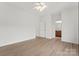 Large bedroom with hardwood floors, ceiling fan, and an en-suite bathroom at 15009 Lisha Ln, Charlotte, NC 28277