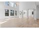 Bright and spacious living room with high ceilings, large windows, hardwood floors and columns at 15009 Lisha Ln, Charlotte, NC 28277