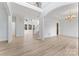 Spacious living room with hardwood floors, high ceilings, and a grand staircase at 15009 Lisha Ln, Charlotte, NC 28277