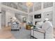 Open-concept living area with fireplace, high ceilings, stylish furnishings, and plenty of natural light at 15009 Lisha Ln, Charlotte, NC 28277