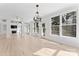 Open living room with a fireplace, lots of natural light, and access to the backyard at 15009 Lisha Ln, Charlotte, NC 28277