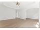 Bright living room with hardwood floors, recessed ceiling, chandelier, and open archway at 15009 Lisha Ln, Charlotte, NC 28277