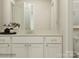 Bathroom vanity with double sinks, white cabinetry and view of the toilet at 1557 Croydon St, Indian Land, SC 29707