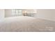 Large bonus room with neutral paint, carpet flooring, and modern railing at 1557 Croydon St, Indian Land, SC 29707