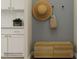 Entryway with a neutral palette, hat, bag, decorative plant and wood cabinet at 1557 Croydon St, Indian Land, SC 29707