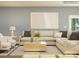 Spacious living room with cozy seating, decorative pillows, and hardwood flooring at 1557 Croydon St, Indian Land, SC 29707