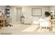 Sunlit living room boasts a modern design with neutral tones, stylish furnishings, and a functional workspace at 1557 Croydon St, Indian Land, SC 29707