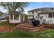 Tiered deck featuring a gazebo, seating, and grill in a spacious backyard at 16421 Breckshire Dr, Huntersville, NC 28078