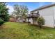 Spacious, well-manicured backyard with a deck, gazebo, and exterior view of the house at 16421 Breckshire Dr, Huntersville, NC 28078